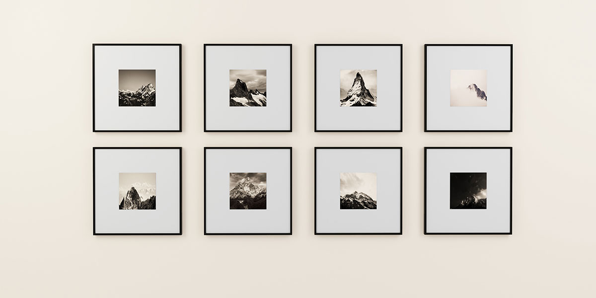 BENEFITS_D2_Frames Eight square frames hanging on a wall